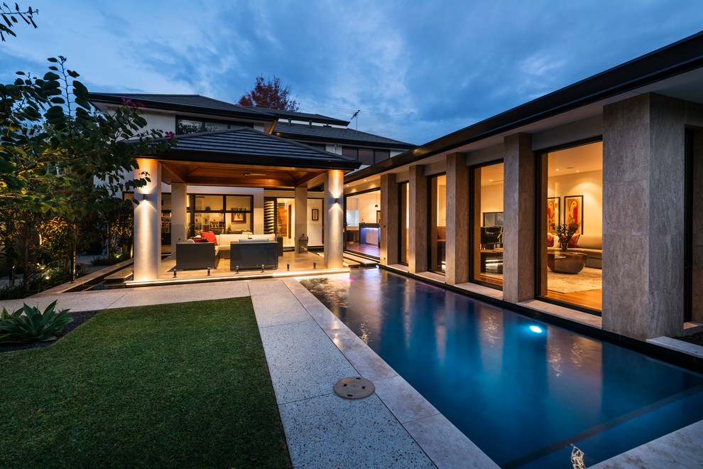 Photo of a small contemporary side yard rectangular lap pool in Perth with tile.