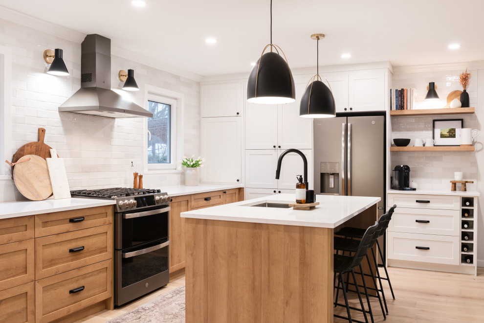 Example of a transitional home design design in Vancouver