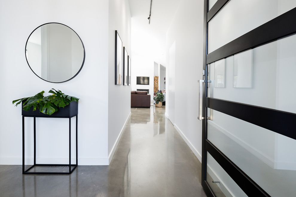 Design ideas for a contemporary hallway in Melbourne with white walls and beige floor.