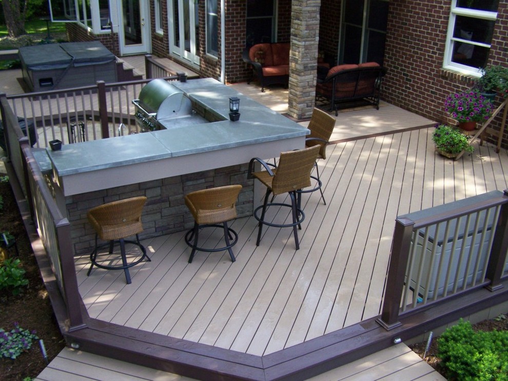 Inspiration for a large backyard outdoor kitchen deck remodel with no cover