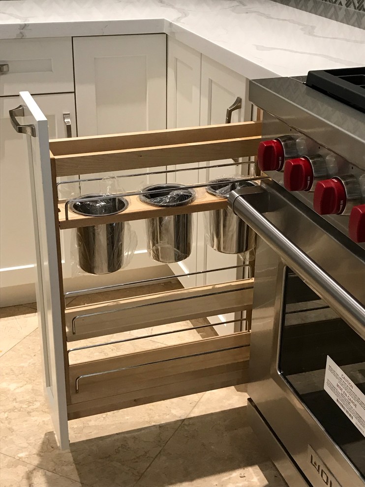 Inspiration for a large transitional kitchen remodel in Miami with a farmhouse sink, shaker cabinets, white cabinets, quartz countertops, gray backsplash, glass tile backsplash, stainless steel appliances, an island and multicolored countertops