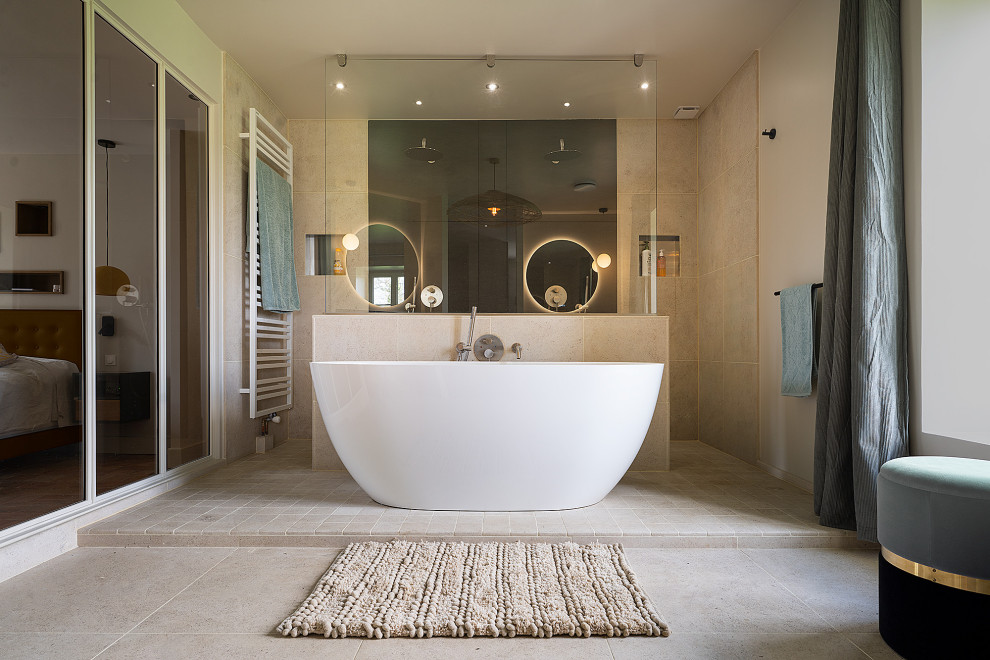 Design ideas for a large contemporary master bathroom in Other with beaded inset cabinets, white cabinets, a freestanding tub, a double shower, beige tile, limestone, beige walls, limestone floors, a vessel sink, wood benchtops, beige floor, an open shower, beige benchtops, a double vanity and a floating vanity.