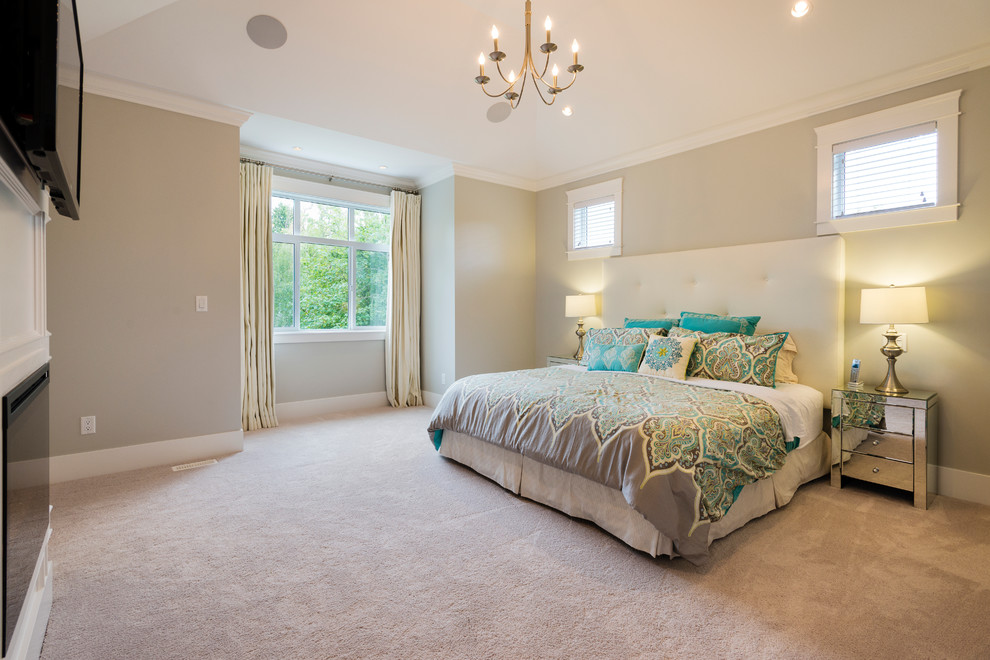 This is an example of a mid-sized transitional master bedroom in Vancouver with grey walls, carpet, a standard fireplace and a wood fireplace surround.