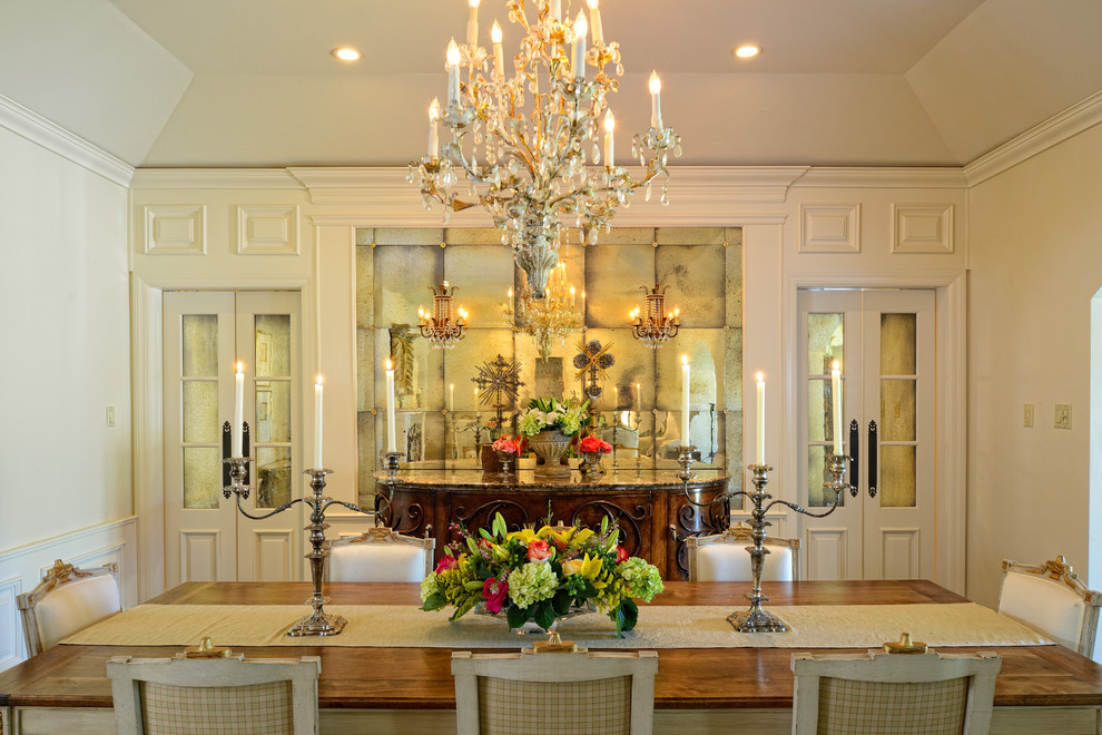 This is an example of a traditional dining room in Austin with beige walls.