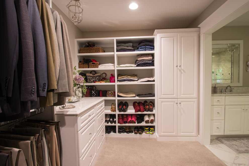 Dressing room - huge transitional carpeted dressing room idea in Cedar Rapids with raised-panel cabinets and white cabinets