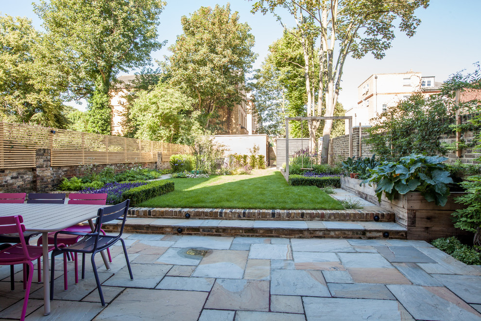 Photo of a mid-sized contemporary patio in London.