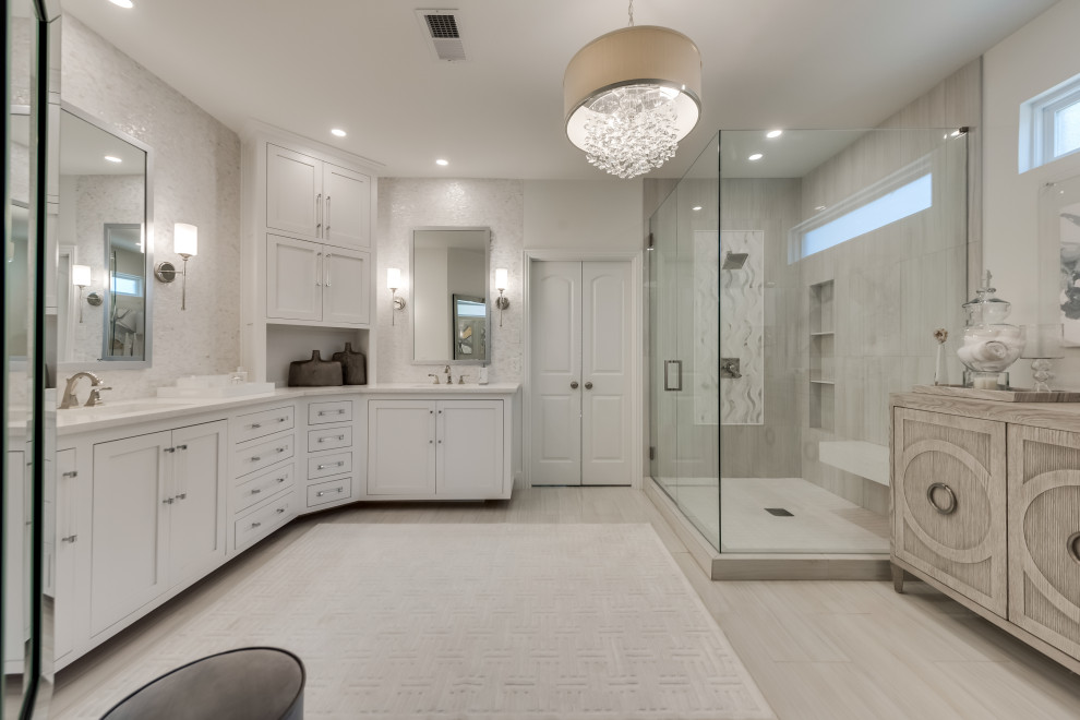 Design ideas for a large transitional master bathroom in Dallas with shaker cabinets, white cabinets, a corner shower, a two-piece toilet, white tile, porcelain tile, white walls, porcelain floors, an undermount sink, engineered quartz benchtops, white floor, a hinged shower door and white benchtops.