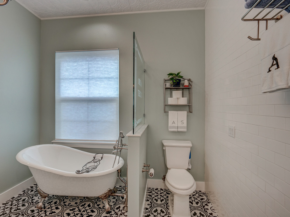 Inspiration for a mid-sized beach style master bathroom in Tampa with shaker cabinets, grey cabinets, a claw-foot tub, an open shower, a two-piece toilet, white tile, ceramic tile, white walls, ceramic floors, a pedestal sink and an open shower.