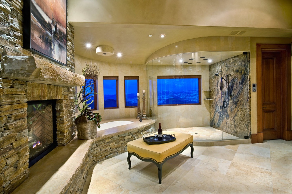 Photo of an expansive arts and crafts master bathroom in Salt Lake City with an undermount tub, beige walls, travertine floors, a corner shower, beige tile, stone tile, a vessel sink, raised-panel cabinets, dark wood cabinets and granite benchtops.
