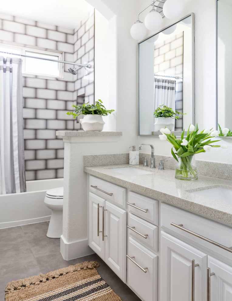Photo of a mid-sized contemporary master bathroom in Houston with flat-panel cabinets, grey cabinets, a freestanding tub, an open shower, a one-piece toilet, white tile, ceramic tile, grey walls, ceramic floors, a vessel sink, granite benchtops, brown floor, an open shower, grey benchtops, a double vanity and a floating vanity.