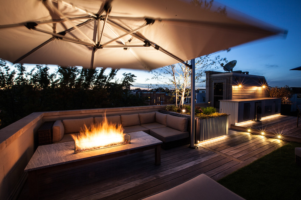 Design ideas for a mid-sized industrial rooftop deck in Chicago with a fire feature and no cover.