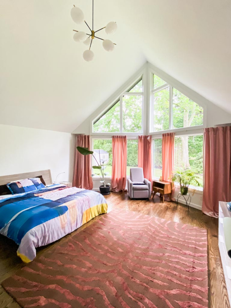 Large contemporary master bedroom in Cleveland with white walls, dark hardwood floors, brown floor and vaulted.