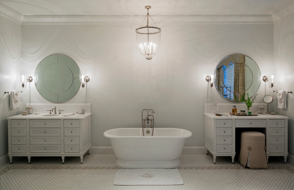 Inspiration for an expansive traditional master bathroom in Miami with flat-panel cabinets, white cabinets, a freestanding tub, white tile, white walls, porcelain floors, an undermount sink, white floor, white benchtops, a niche, a double vanity, a freestanding vanity, marble benchtops and recessed.