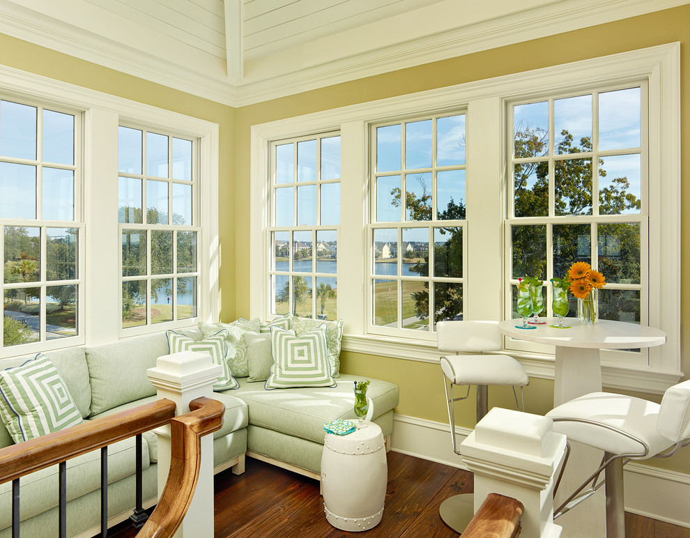 This is an example of a beach style sunroom in Charleston.