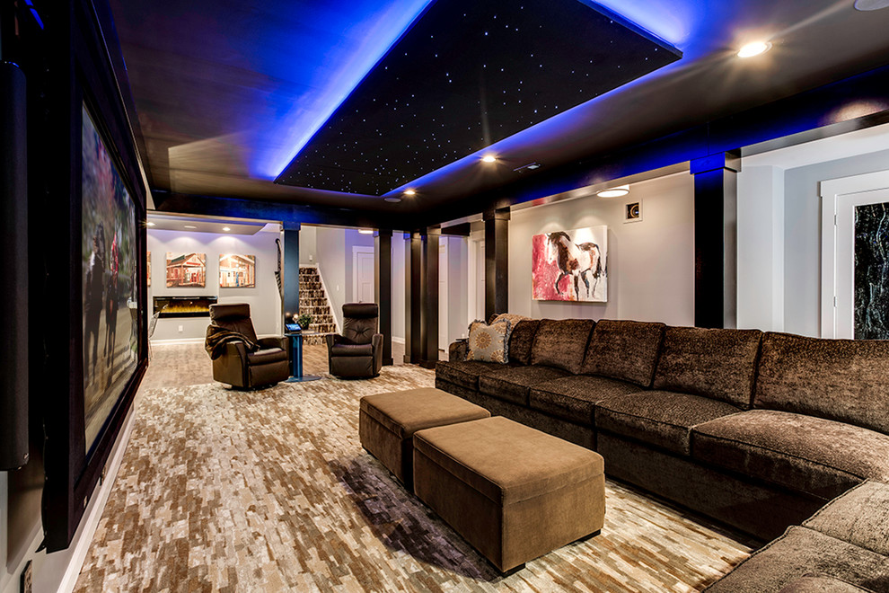 Inspiration for an expansive contemporary open concept home theatre in Baltimore with beige walls, carpet and a projector screen.