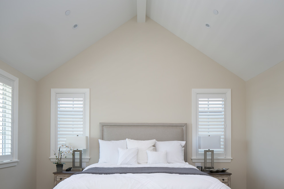 Example of a transitional bedroom design in Orange County