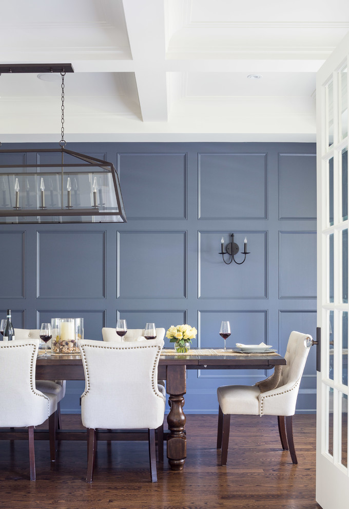 Transitional separate dining room in Toronto with blue walls and dark hardwood floors.