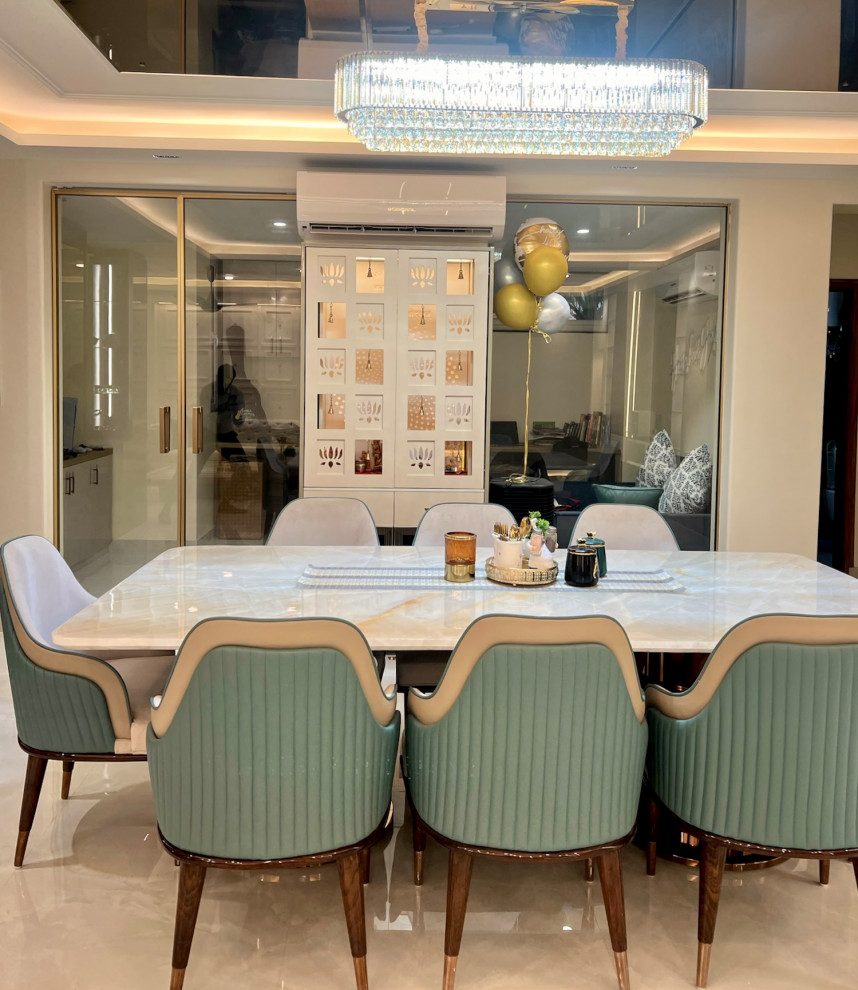 This is an example of a contemporary dining room in Delhi.