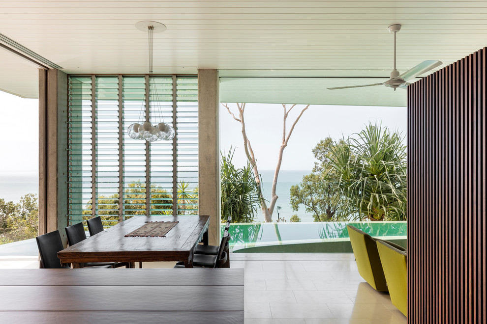 Design ideas for a tropical dining room in Cairns.