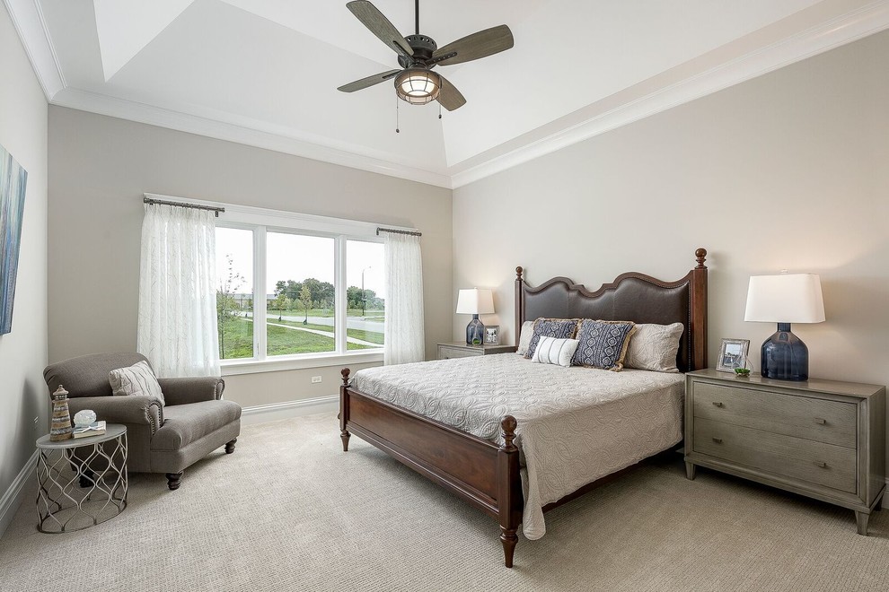 Photo of a mid-sized transitional master bedroom in Chicago with beige walls, carpet and beige floor.