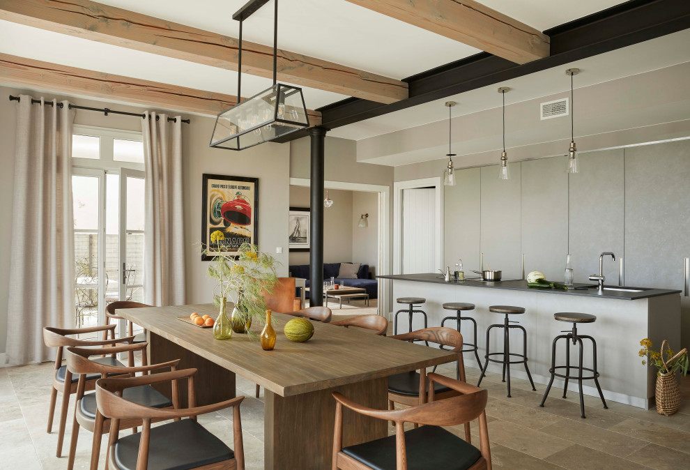 Inspiration for a large transitional kitchen/dining combo in Montpellier with beige walls, travertine floors, no fireplace, beige floor and exposed beam.