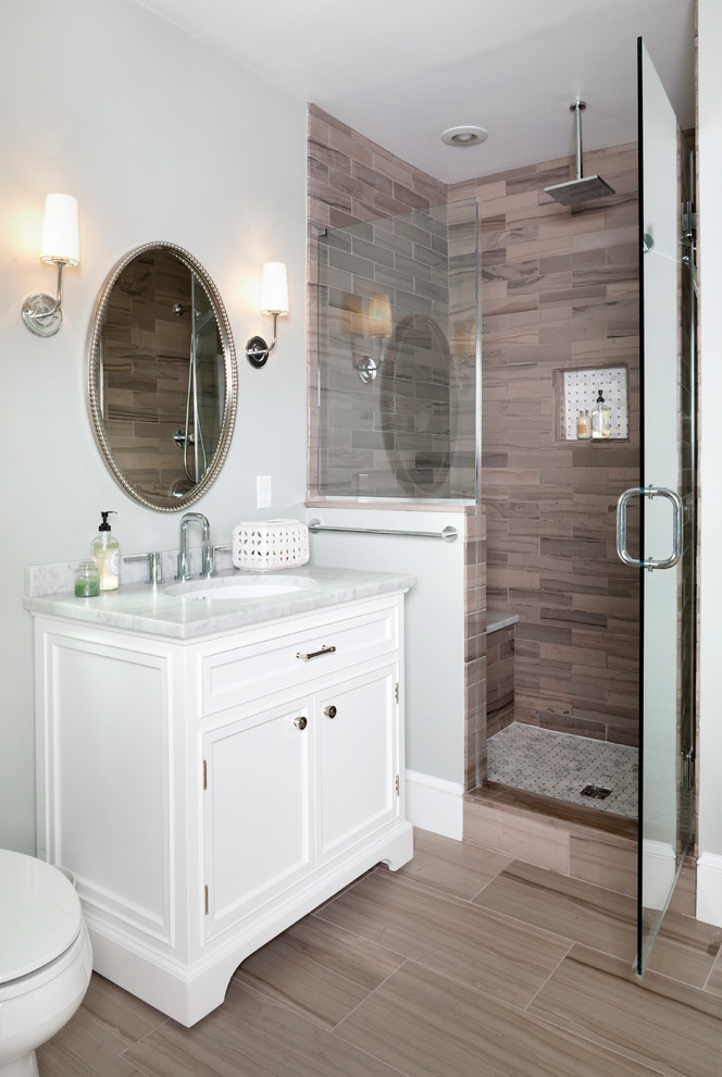 Mid-sized transitional master bathroom in DC Metro with shaker cabinets, white cabinets, an alcove shower, a one-piece toilet, brown tile, stone tile, green walls, terra-cotta floors, an undermount sink and marble benchtops.