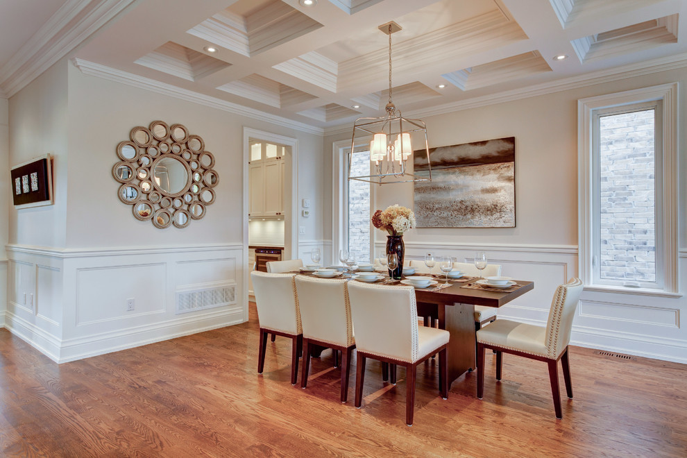 Mid-sized transitional dining room in Toronto with grey walls, dark hardwood floors, no fireplace, brown floor, coffered and decorative wall panelling.