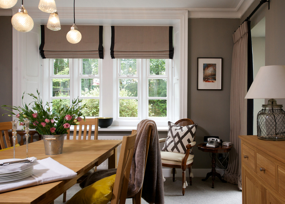 Traditional dining room in Other with grey walls.