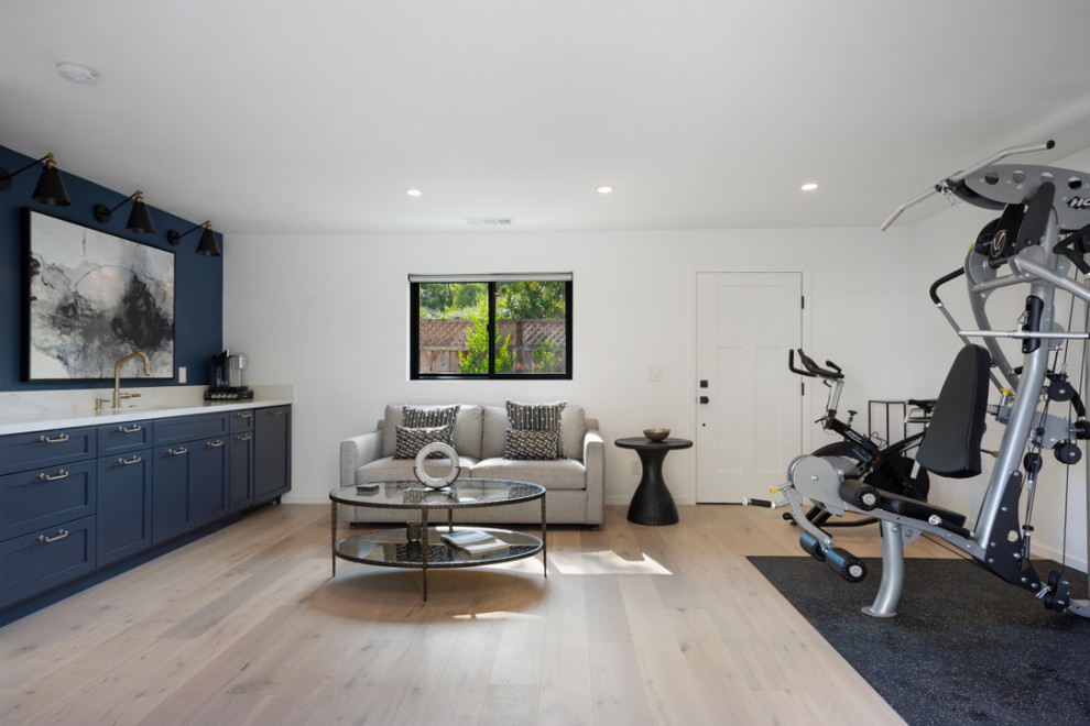 Inspiration for a mid-sized country multipurpose gym in San Francisco with light hardwood floors.