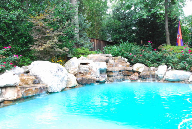 Pool with stone water fall american-traditional-swimming-pool