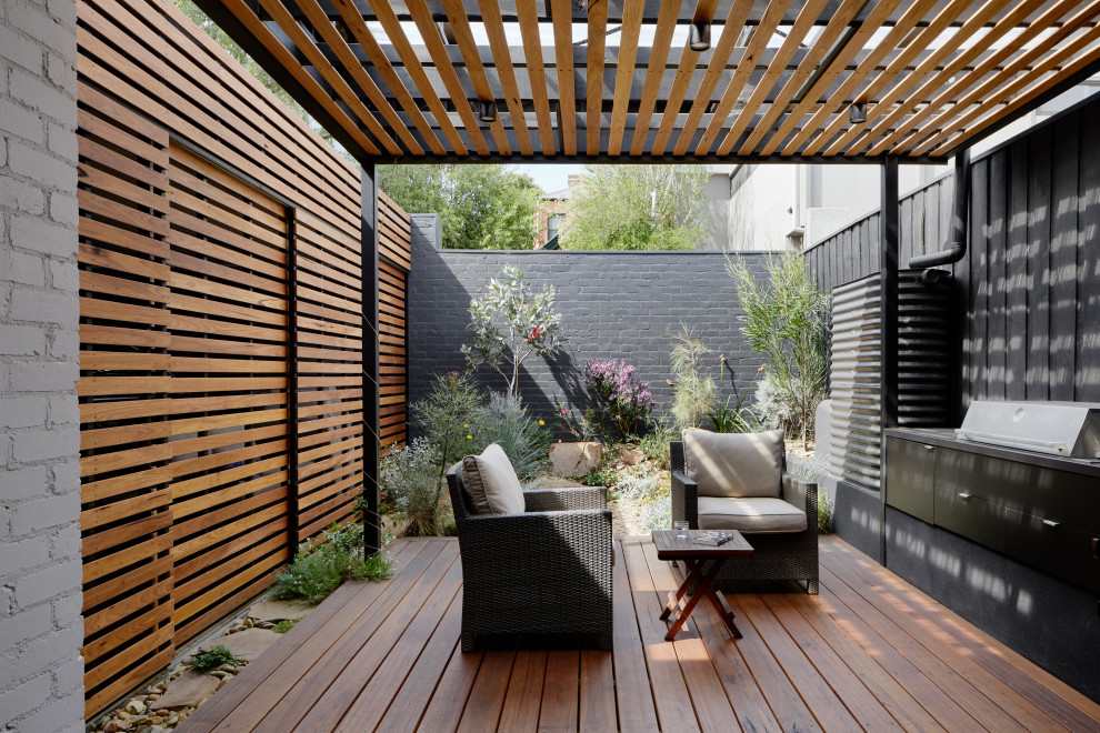 Photo of a small backyard patio in Melbourne with decking and a pergola.
