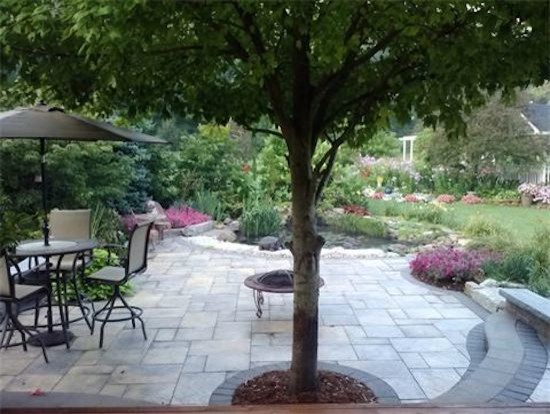 This is an example of a mid-sized mediterranean backyard partial sun garden in Columbus with concrete pavers.