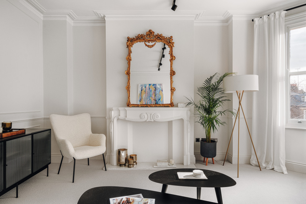 Design ideas for a medium sized bohemian formal and grey and black enclosed living room in London with white walls, carpet, a timber clad chimney breast, no tv, grey floors, wainscoting and a chimney breast.