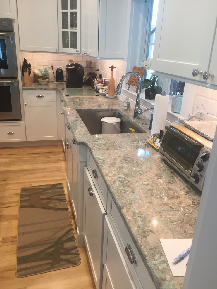 Inspiration for a large transitional u-shaped kitchen in Other with shaker cabinets, medium wood cabinets, quartz benchtops, with island and multi-coloured benchtop.