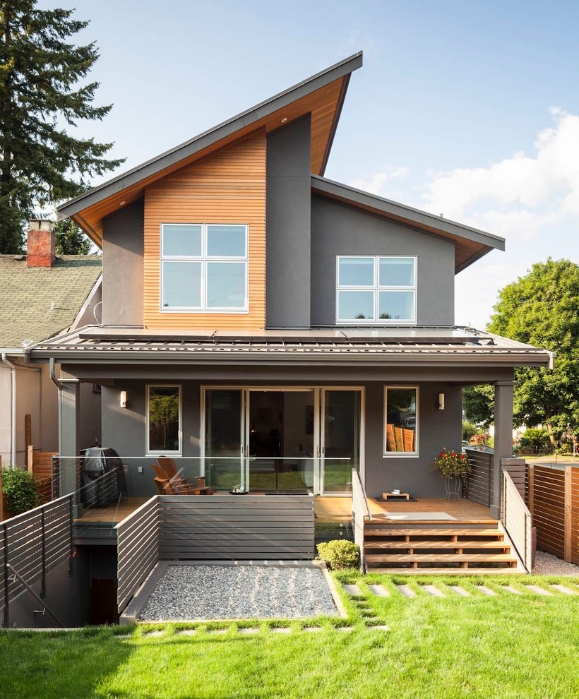 This is an example of a contemporary grey exterior in Vancouver with mixed siding.