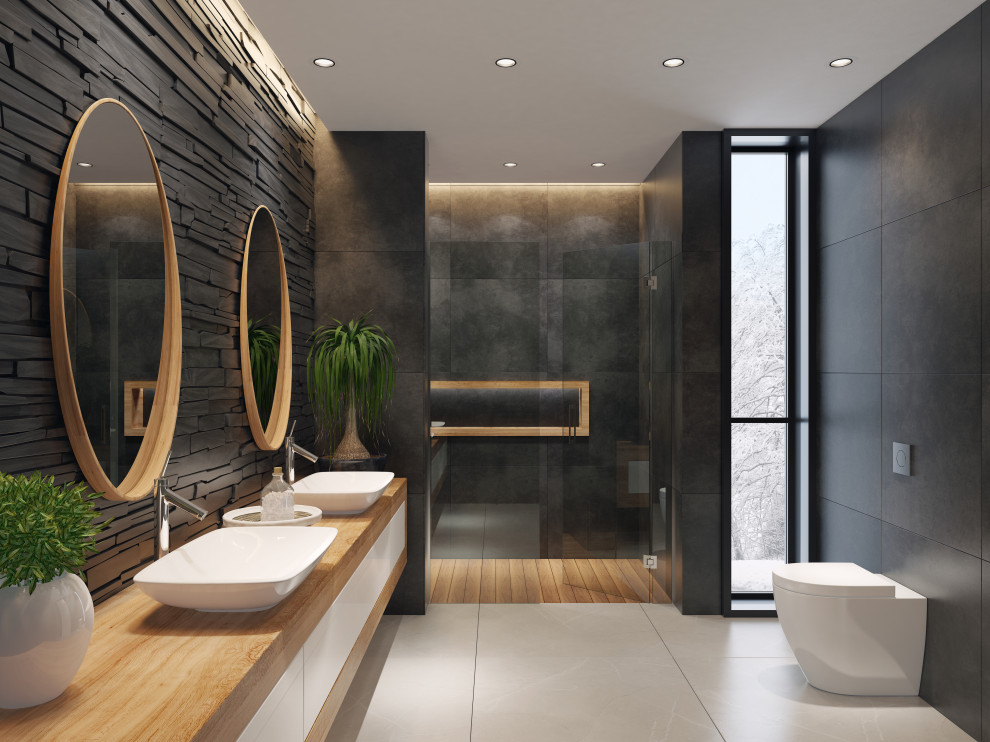 Design ideas for a mid-sized modern master bathroom in Malaga with flat-panel cabinets, white cabinets, a curbless shower, a wall-mount toilet, black tile, ceramic tile, black walls, porcelain floors, a vessel sink, wood benchtops, beige floor, a hinged shower door and brown benchtops.