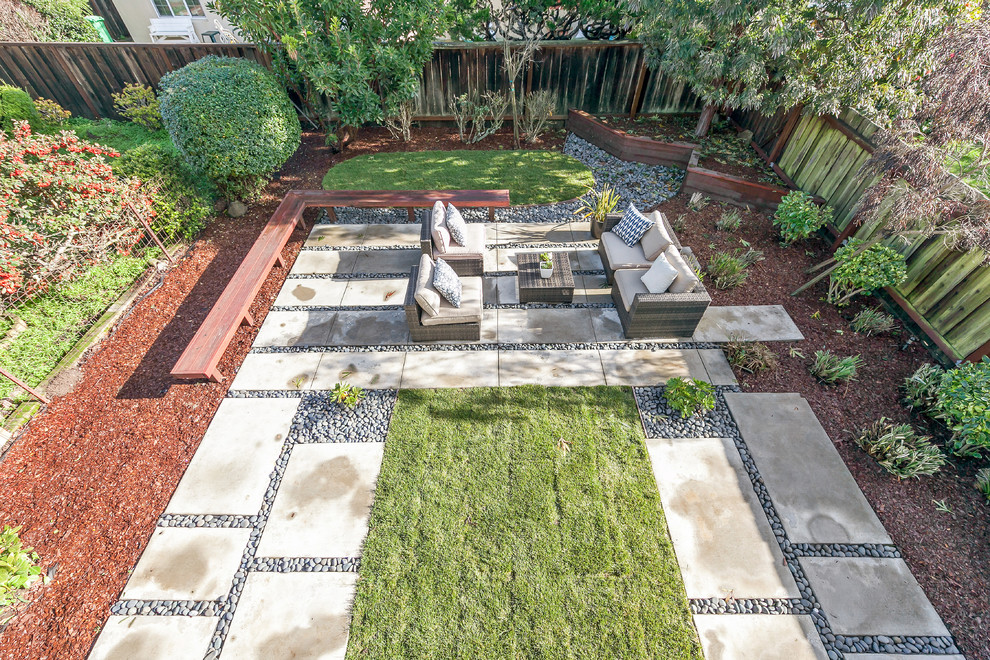 Photo of a mid-sized backyard patio in San Francisco with concrete slab and no cover.