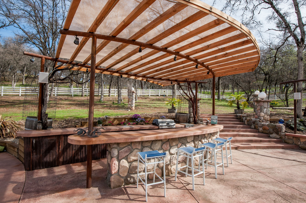 Photo of a country patio in Sacramento with a gazebo/cabana.