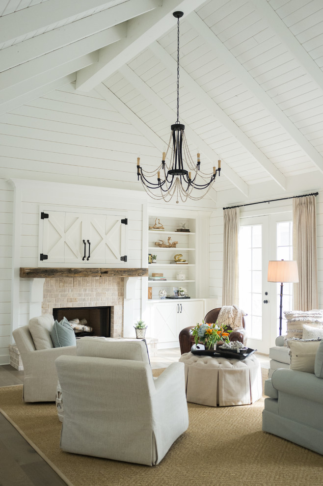 Inspiration for a country formal living room in Atlanta with white walls, dark hardwood floors, a standard fireplace and a brick fireplace surround.