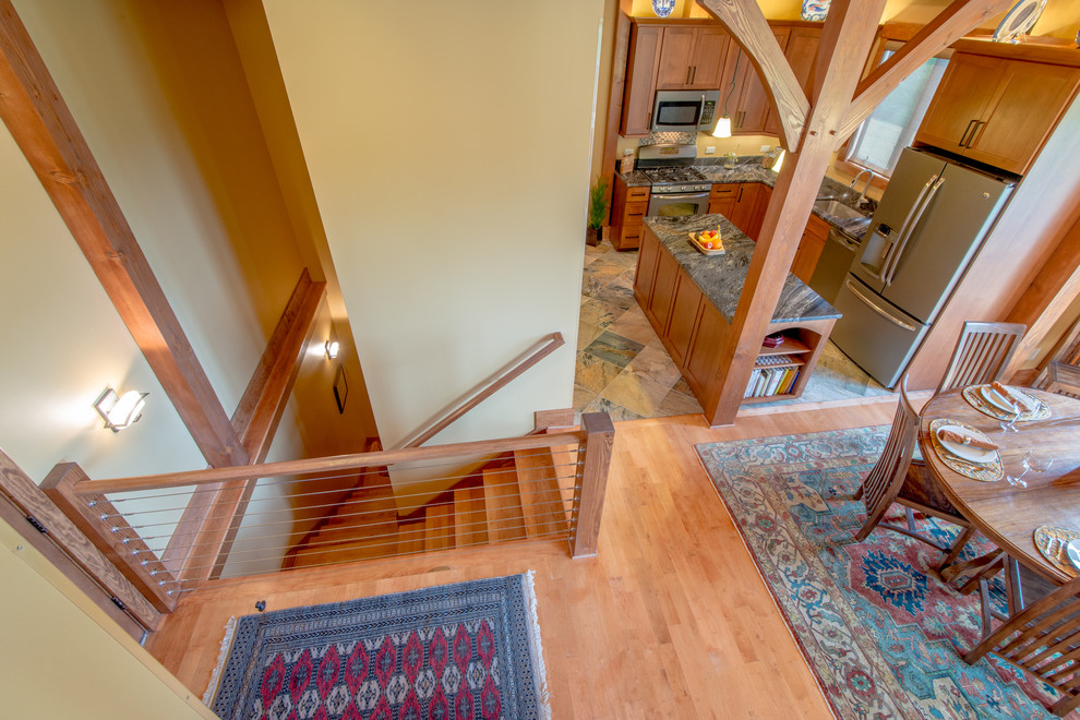 Inspiration for a rustic medium tone wood floor single front door remodel with a medium wood front door