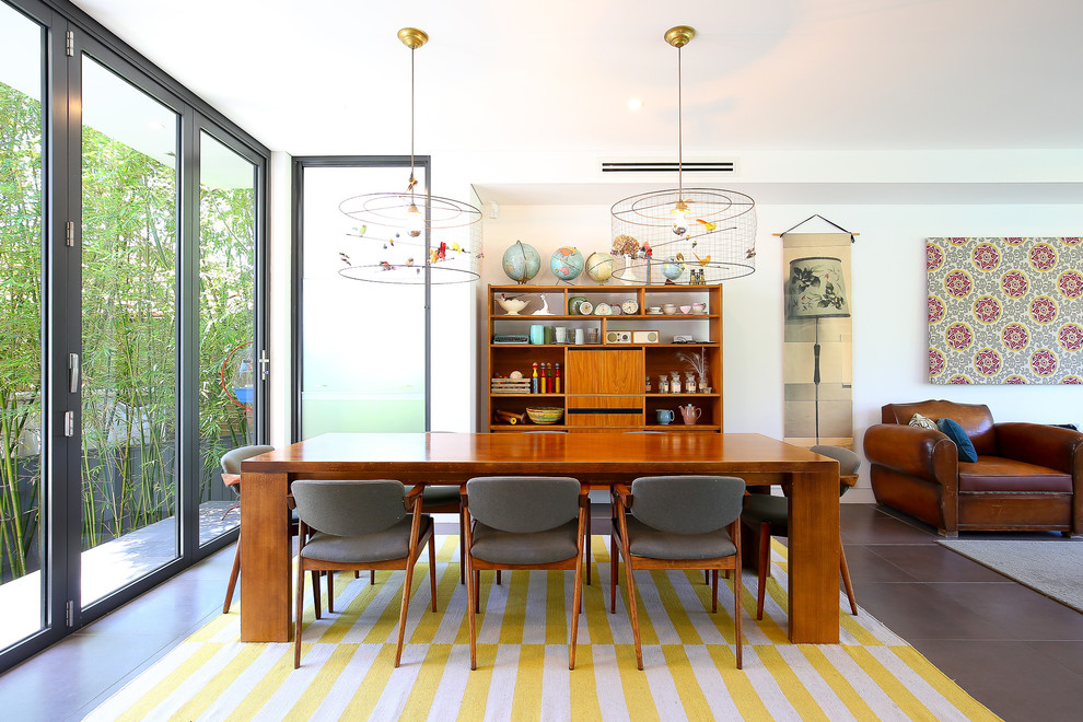 Inspiration for an eclectic open plan dining in Sydney with white walls.