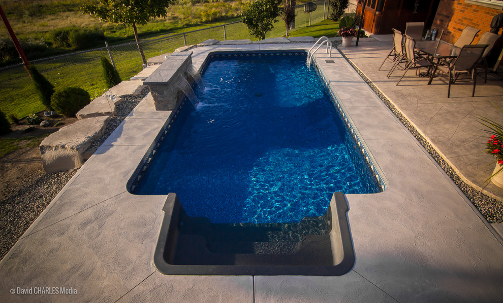 Pool fountain - mid-sized transitional backyard concrete and rectangular natural pool fountain idea in Toronto