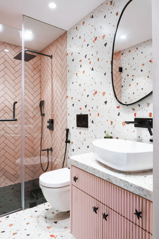 Bathroom - mid-sized shabby-chic style kids' white tile and subway tile ceramic tile, single-sink and white floor bathroom idea in Mumbai with furniture-like cabinets, a wall-mount toilet, a vessel sink, a hinged shower door, a built-in vanity, white cabinets, white walls, terrazzo countertops and white countertops