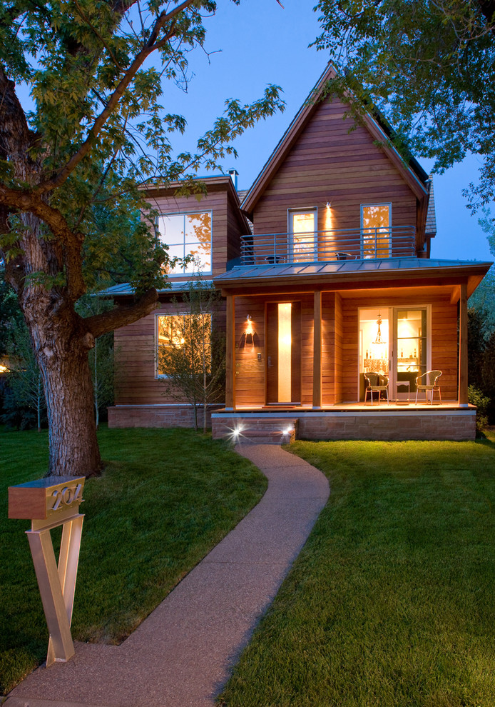Transitional brown two-story wood exterior home idea in Denver