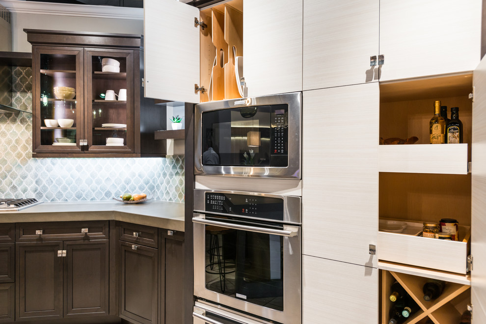 Kitchen - transitional kitchen idea in Phoenix with recessed-panel cabinets, dark wood cabinets, concrete countertops, blue backsplash, ceramic backsplash and stainless steel appliances