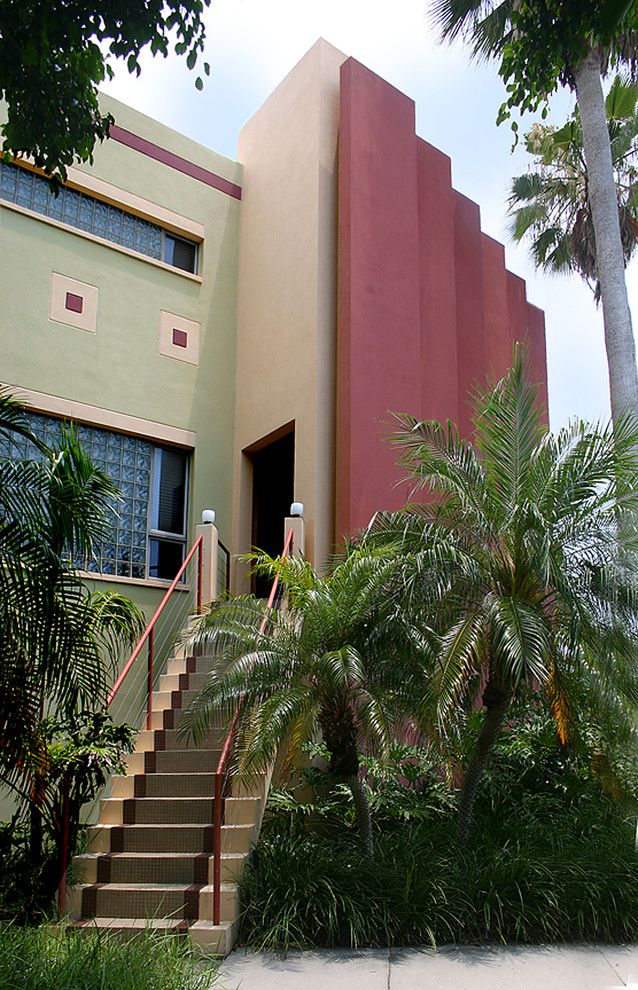 Small modern vestibule in Tampa with beige walls, ceramic floors, a single front door and a red front door.