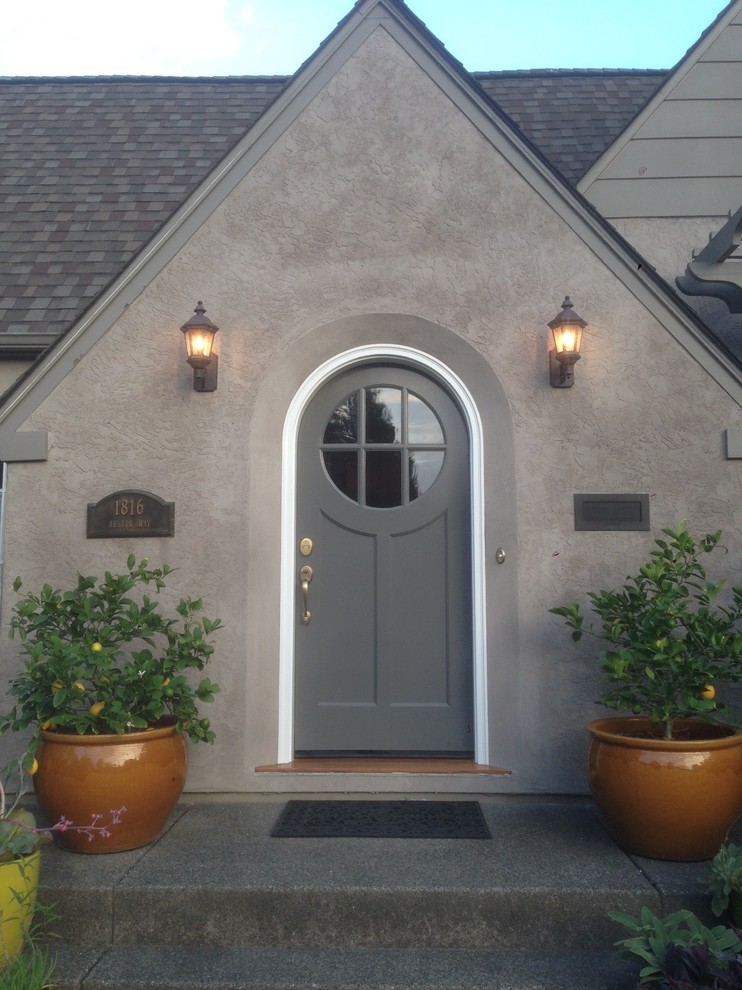 Photo of a large traditional front door in San Francisco with grey walls, a single front door and a gray front door.