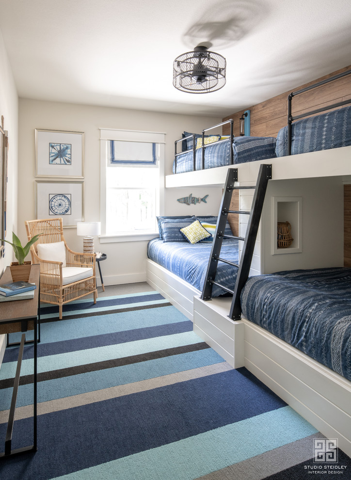 Mid-sized modern guest bedroom with white walls, carpet and blue floor.