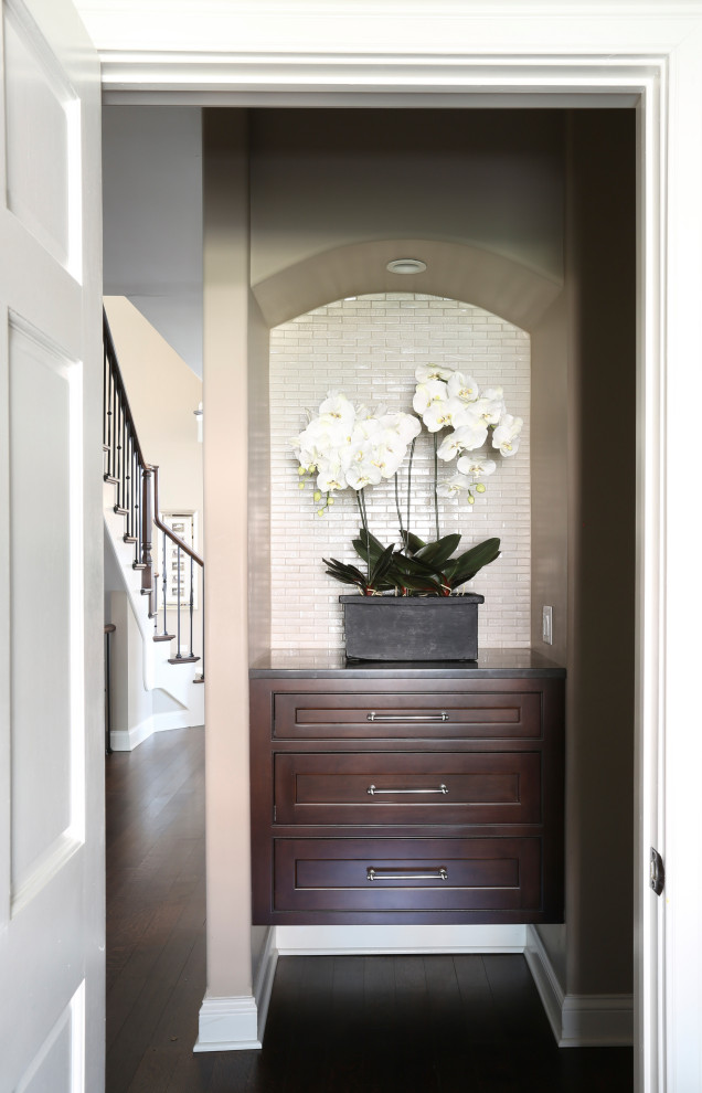 Inspiration for a small classic vestibule in Chicago with beige walls, dark hardwood flooring and brown floors.