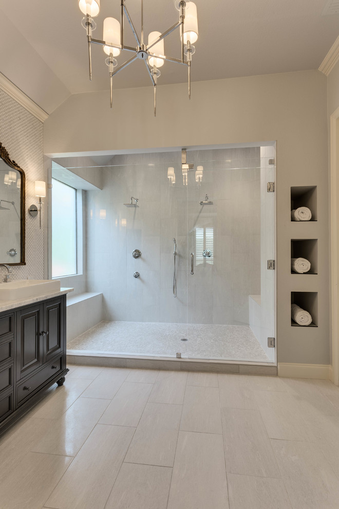 Design ideas for a large contemporary master bathroom in Dallas with raised-panel cabinets, dark wood cabinets, an alcove shower, a two-piece toilet, white tile, marble, white walls, ceramic floors, a vessel sink, marble benchtops, white floor and a hinged shower door.